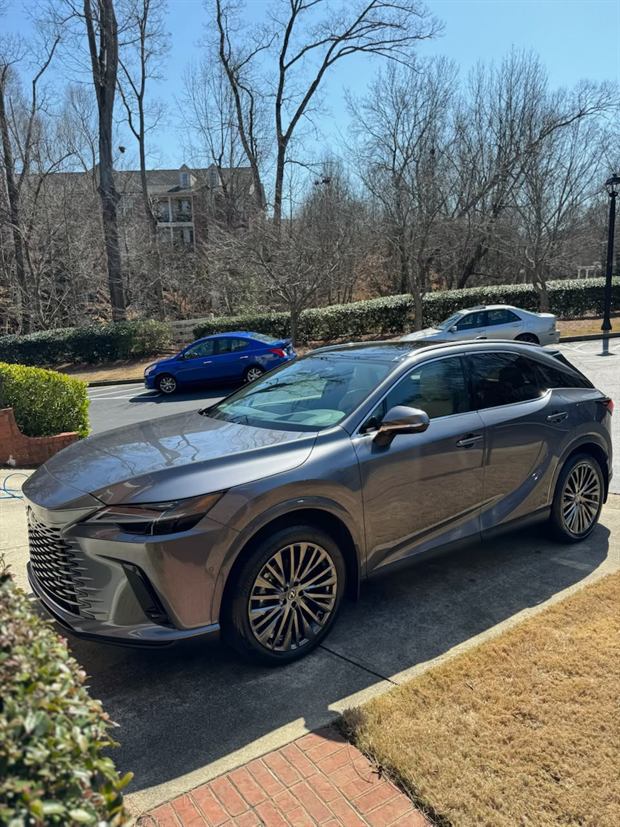 Grey Lexus RX washed and parked on a driveway